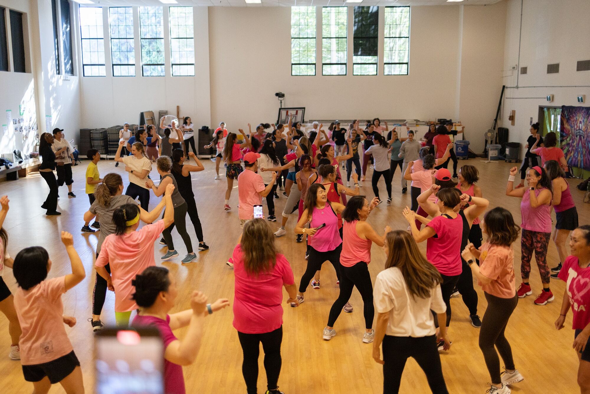 A packed floor of dancers mid-routine at the 2025 Zumbathon